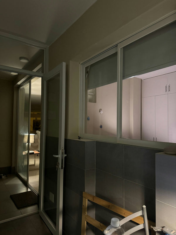 The interior of a modern apartment hallway lit at night