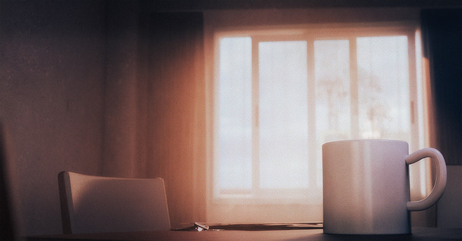 Steaming mug resting near a bright window