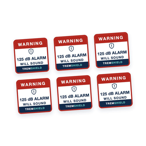 Six TremShield warning decals reading Warning, 125 dB alarm will sound