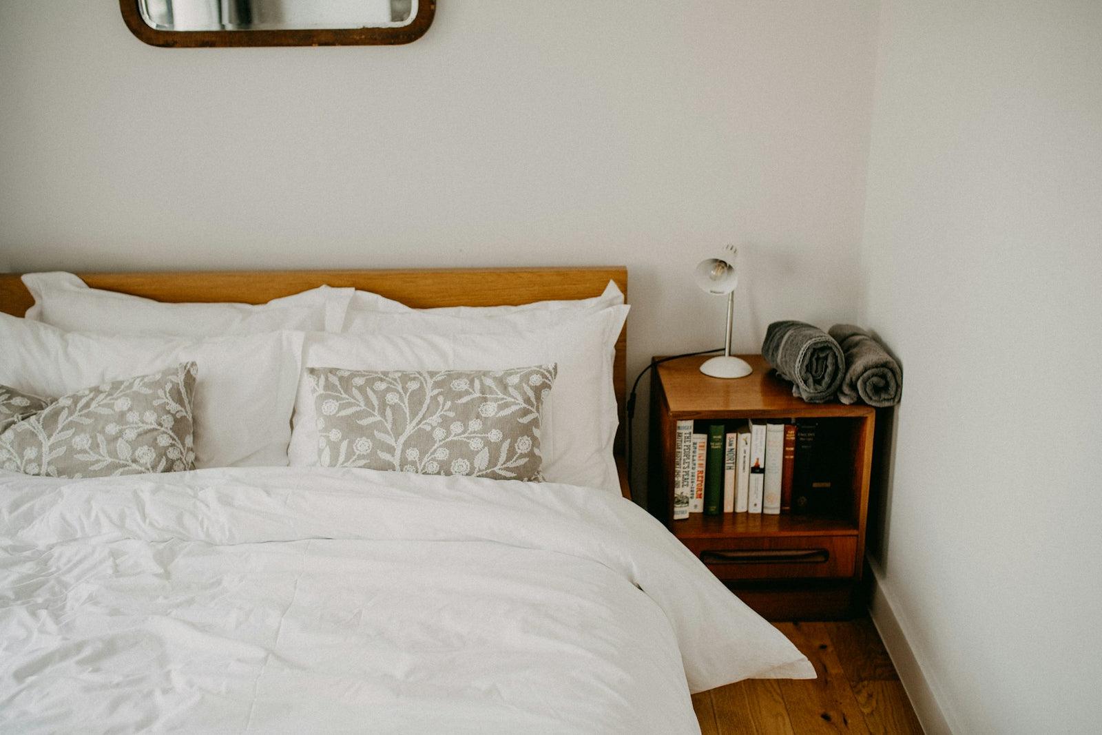 Cozy guest bedroom with a neatly made bed and bedside table