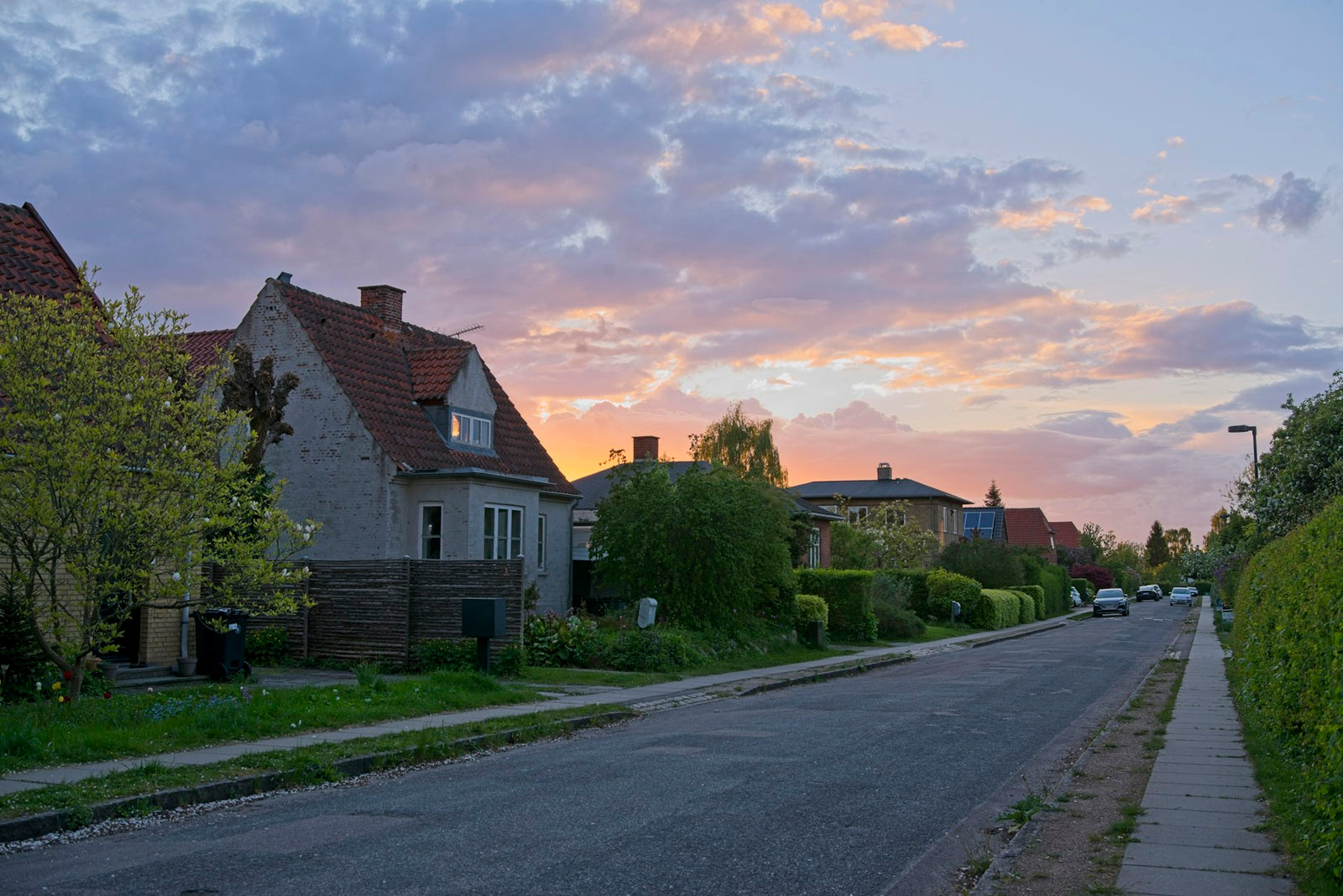 Quiet suburban street of homes at sunset