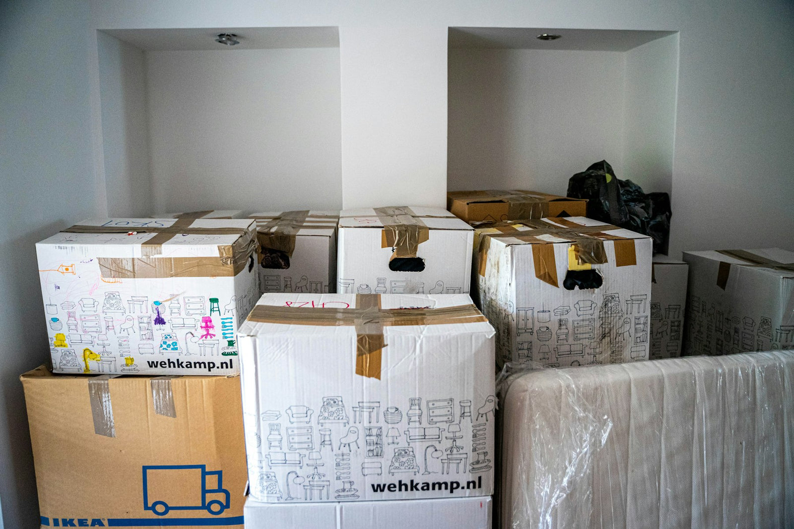 Cardboard moving boxes stacked on a wooden table