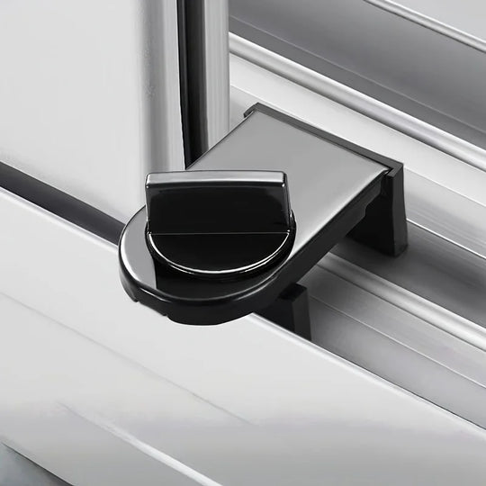 Black no-drill lock secured onto a white sliding window track, included as a free gift