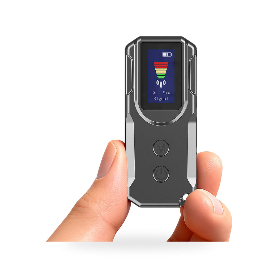 Hand holding a pocket-size hidden camera detector with a small display showing a signal bar graph