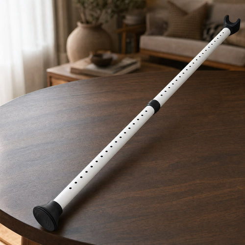 White adjustable TremShield door security bar with padded fork and rubber floor foot