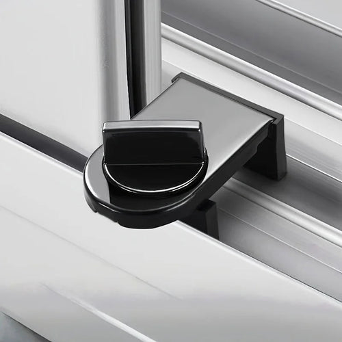 Black no-drill window and door lock clamped onto a white sliding track with its thumb-turn knob tightened