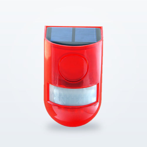 Red solar motion siren, front view, with the solar panel on top and the white motion sensor window below