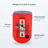 Back of the solar siren with labels for the metal bracket with keyhole slots, the mode button and the 5V port