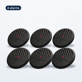 Six black TremShield vibration alarms arranged in two rows, the TremShield 6-Pack